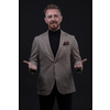 Portrait of a stylish elegant senior businessman with a beard and casual business clothes in photo studio isolated on dark background gesturing with hands. High quality photo