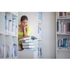 Cute female university/highschool student with books in library