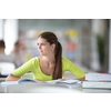 Cute female university/highschool student with books in library