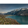 The crystal clear blue water of Lake Brienz in the Swiss Alps - Switzerland from above