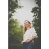 Portrait of a relaxed middle aged woman outdoors, looking happy, enjoying the life
