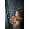 Pretty,young woman taking a long hot shower in a modern bathroom