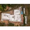 Aerial image of a new family house being built. New private housing development construction in rural countryside aerial view.