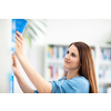 Cute female university/highschool student with books in library