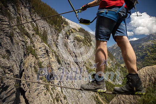 Kandersteg - amazing vacation destination in the Swiss Alps, Switzerland. Couple on a lovely via ferrata Kandersteg - amazing vacation destination in the Swiss Alps, Switzerland. Couple on a lovely via ferrata