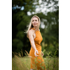Portrait of a relaxed middle aged woman outdoors, looking happy, enjoying the life