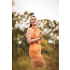 Portrait of a relaxed middle aged woman outdoors, looking happy, enjoying the life