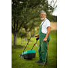 Senior gardenr gardening in his permaculture garden