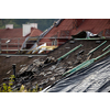 Storm damaged roof, destroyed roof tiles, expensive damage needing prompt repair
