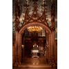 Splendid chandelier with lit candles in a beautiful room of an old mansion