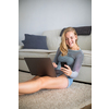 Teenage girl using her  smart phone and laptop computer (shalllow DOF, color toned image)