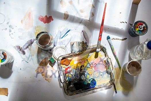 Palette and paint brush in artist hands. Artist paints oil picture with paint brush in hand palette close-up. Artist painting holding palette and paint brush in hand. Artists paintbrush with palette. Palette and paint brush in artist hands. Artist paints oil picture with paint brush in hand palette close-up. Artist painting holding palette and paint brush in hand. Artists paintbrush with palette.