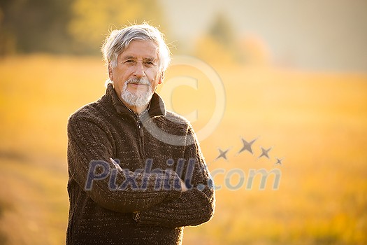 Happy senior man enjoying a lovele autumn day outdoors Happy senior man enjoying a lovele autumn day outdoors