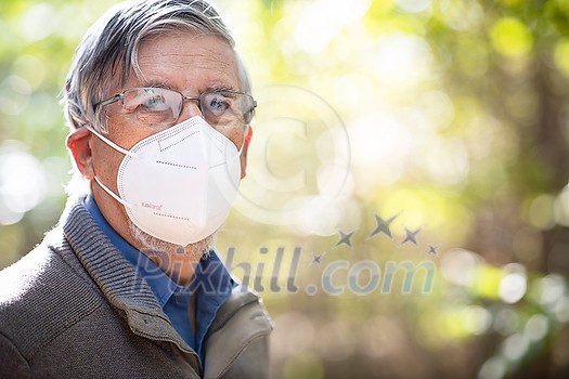 Senior man with glasses fogged due to condensation caused by the use of a face mask, respirator Senior man with glasses fogged due to condensation caused by the use of a face mask, respirator