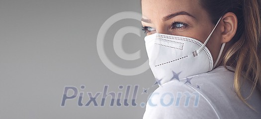 Young woman wearing a face mask during coronavirus and flu outbreak. Virus and illness protection, home quarantine. COVID-19 concept Young woman wearing a face mask during coronavirus and flu outbreak. Virus and illness protection, home quarantine. COVID-19 concept