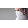 Young woman wearing a face mask during coronavirus and flu outbreak. Virus and illness protection, home quarantine. COVID-19 concept