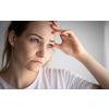 Anxious, worried, stressed young woman looking pensive, pondering, deep in thoughts.