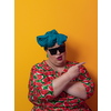Funny plus size sexy model woman with trendy sunglasses, fashionable overweight blonde in colorful dress posing at the yellow fortuna gold background in studio. High quality photo