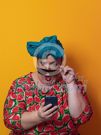 Trendy plus size woman having conversation talking by smartphone over yellow background smiling with an idea or question pointing finger with happy face, number one. High quality photo Trendy plus size woman having conversation talking by smartphone over yellow background smiling with an idea or question pointing finger with happy face, number one. High quality photo