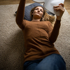 Pretty, young woman using her smart phone at home