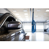 Car in a garage undergoing  regular checks (shallow DOF/color toned image)