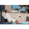 A modern senior man in casual clothes enjoys a vacation in an expensive house. Selective focus. High-quality photo