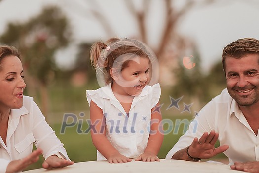 Senior couple in casual clothes with their children spending time in the park a vacation together. Family time. Selective focus. High-quality photo Senior couple in casual clothes with their children spending time in the park a vacation together. Family time. Selective focus. High-quality photo