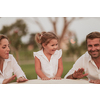 Senior couple in casual clothes with their children spending time in the park a vacation together. Family time. Selective focus. High-quality photo