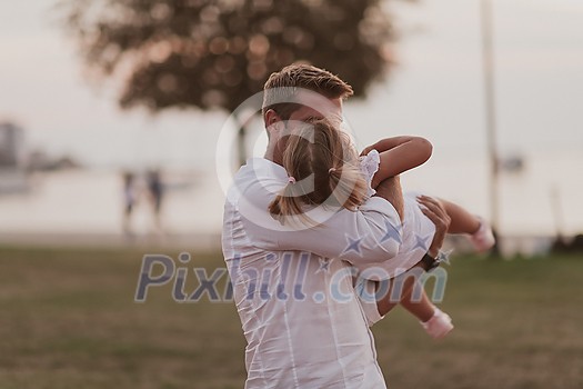 An elderly man in casual clothes with his daughter spends time together in the park on vacation. Family time. Selective focus. High-quality photo An elderly man in casual clothes with his daughter spends time together in the park on vacation. Family time. Selective focus. High-quality photo