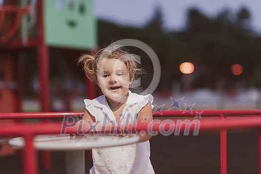 A little girl in modern summer clothes playing in the park in summer. Selective focus. High-quality photo A little girl in modern summer clothes playing in the park in summer. Selective focus. High-quality photo