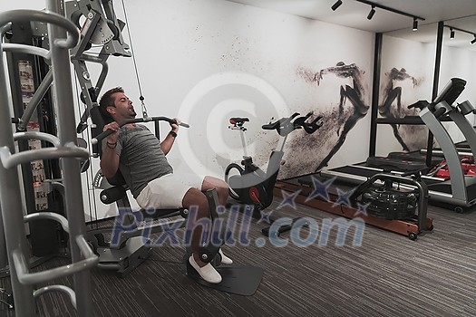 Struggling with age. Confident senior man exercising in the health club. Selective focus. High-quality photo Struggling with age. Confident senior man exercising in the health club. Selective focus. High-quality photo