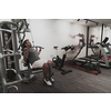 Struggling with age. Confident senior man exercising in the health club. Selective focus. High-quality photo