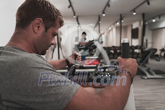 Struggling with age. Confident senior man exercising in the health club. Selective focus. High-quality photo Struggling with age. Confident senior man exercising in the health club. Selective focus. High-quality photo