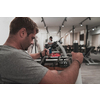 Struggling with age. Confident senior man exercising in the health club. Selective focus. High-quality photo