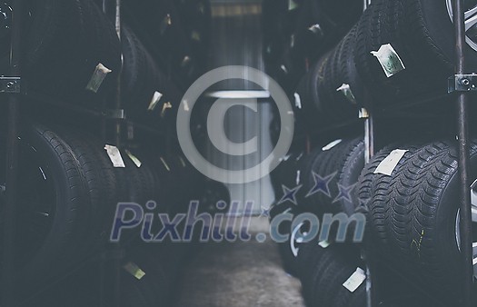 Tyre change - wheel balancing or repair and change car tire at auto service garage or workshop by mechanic Tyre change - wheel balancing or repair and change car tire at auto service garage or workshop by mechanic