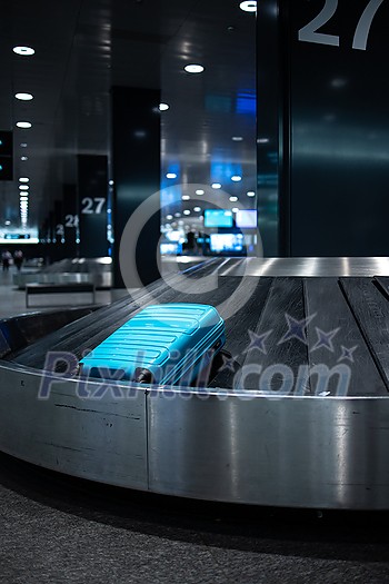 Luggage on the luggage claim conveyor belt at an international airport Luggage on the luggage claim conveyor belt at an international airport