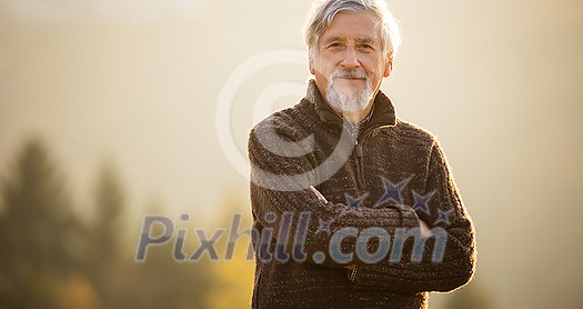 Happy senior man enjoying a lovele autumn day outdoors Happy senior man enjoying a lovele autumn day outdoors