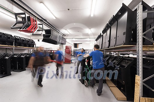 Blurred movement of workers in the modern heavy industry while doing the jobs they are in charge of. Blurred photo. Selective focus. High-quality photo