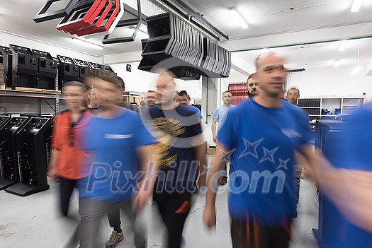 Blurred movement of workers in the modern heavy industry while doing the jobs they are in charge of. Blurred photo. Selective focus. High-quality photo Blurred movement of workers in the modern heavy industry while doing the jobs they are in charge of. Blurred photo. Selective focus. High-quality photo