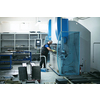 A smart factory worker or engineer makes machines in a production workshop. The concept of industry and engineering. Selective focus. High-quality photo