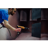 The painter paints the iron element. Industrial painting parts. Metal designs. High-quality photo