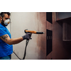The painter paints the iron element. Industrial painting parts. Metal designs. High-quality photo