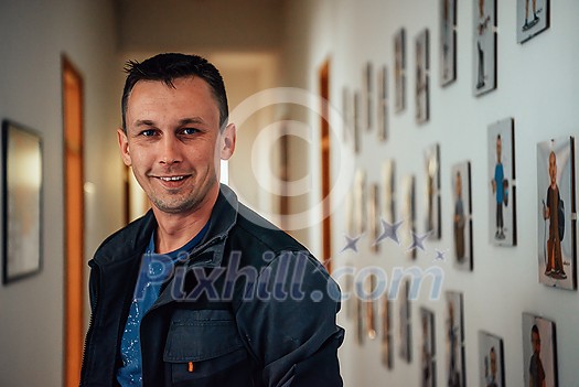 a portrait of a man in a work suit standing in the hallway of a factory. High quality photo a portrait of a man in a work suit standing in the hallway of a factory. High quality photo