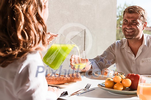 Senior couple eating a healthy breakfast together early in the morning in a luxury house. Selective focus. High-quality photo Senior couple eating a healthy breakfast together early in the morning in a luxury house. Selective focus. High-quality photo