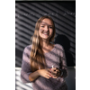 Pretty, young female student/teacher in front of a blackboard during math class