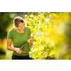 Woman picking grape during wine harvest