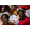 University students sitting in class, taking notes