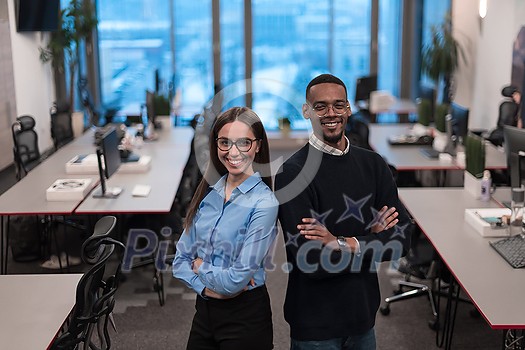 Two happy diverse professional executive business team people woman and African American man looking at camera standing in office lobby hall. Multicultural company managers team portrait. High-quality photo Two happy diverse professional executive business team people woman and African American man looking at camera standing in office lobby hall. Multicultural company managers team portrait. High-quality photo
