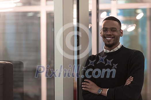 African American man looking at camera standing in office lobby hall. Multicultural company managers team portrait. High-quality photo African American man looking at camera standing in office lobby hall. Multicultural company managers team portrait. High-quality photo