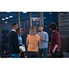 Successful team. Group of young businesspeople working and communicating together in creative office. Selective focus. High-quality photo